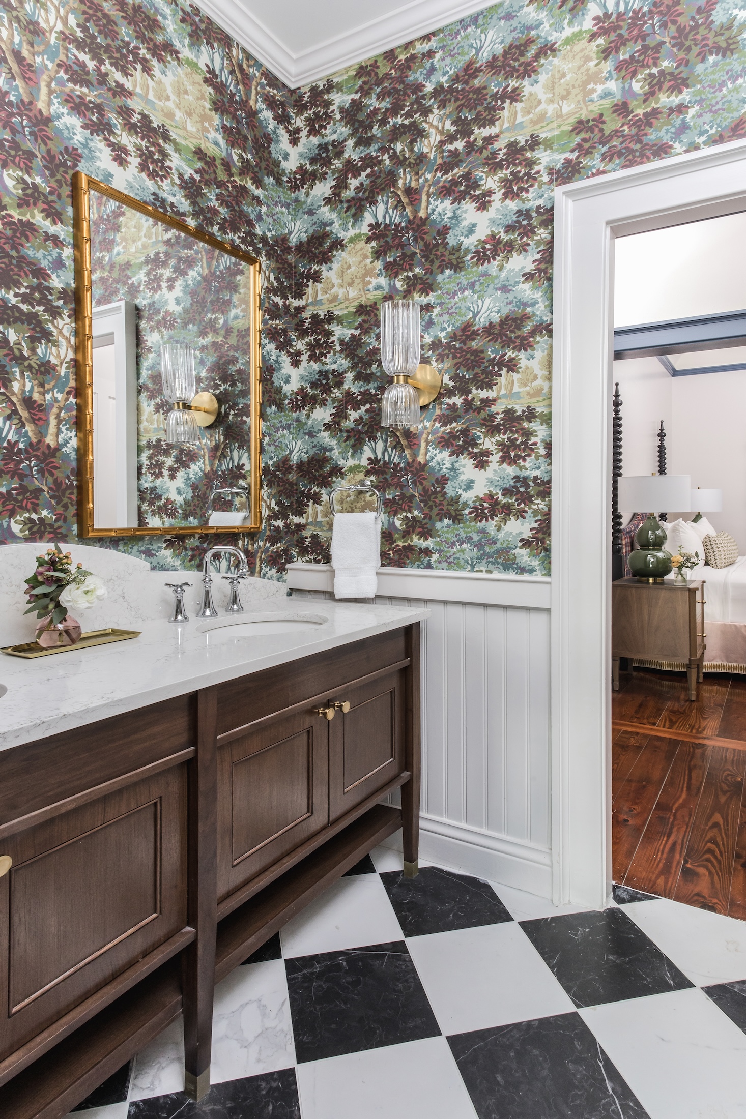 A bathroom with ornate wallpaper in the Arbor Cottages at Barnsley Resort.