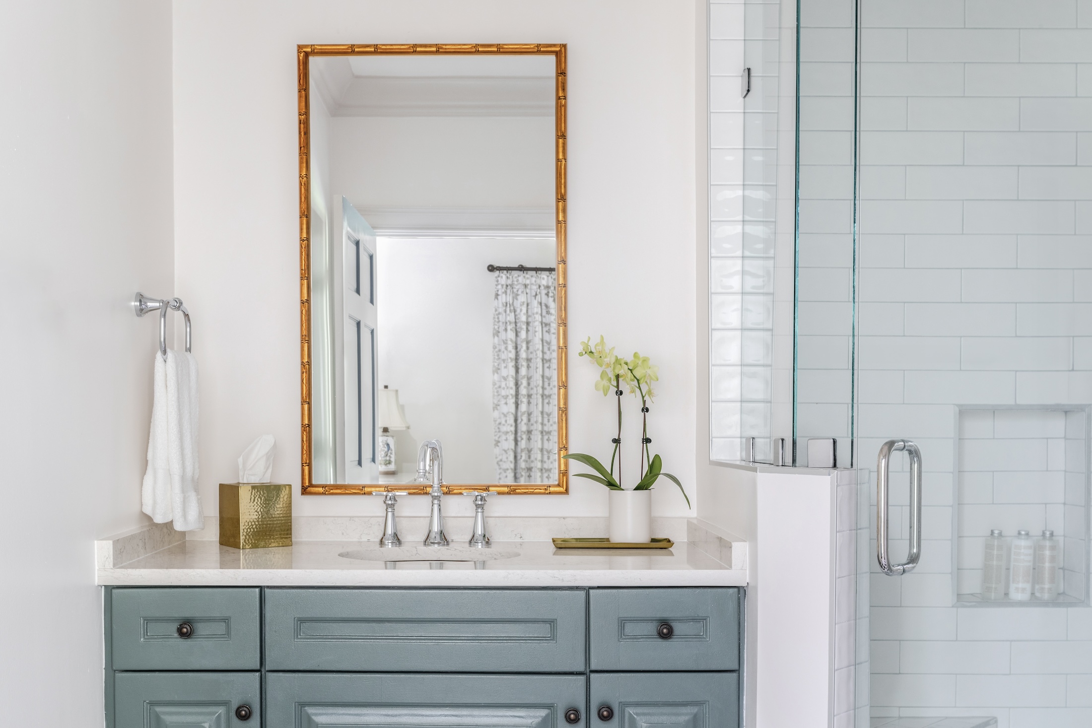 The sink area and shower of the bathroom in the Julis Cottage at Barnsley Resort.
