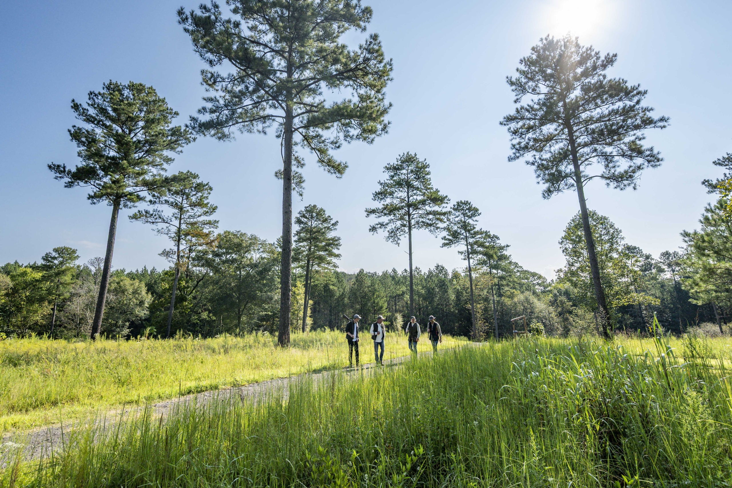 men walking at sporting clays course
