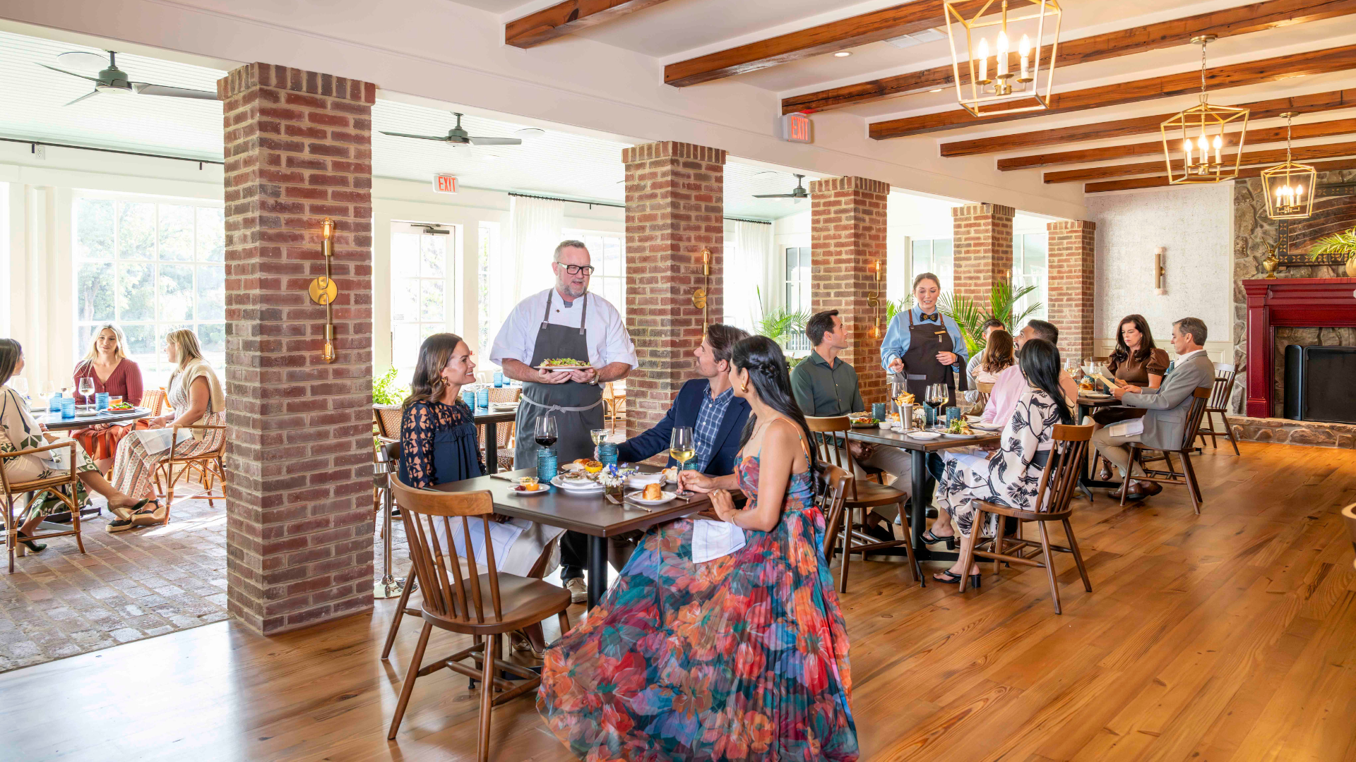 dining room at restaurant with guests and chef