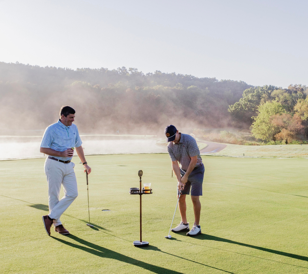 two men on a putting course