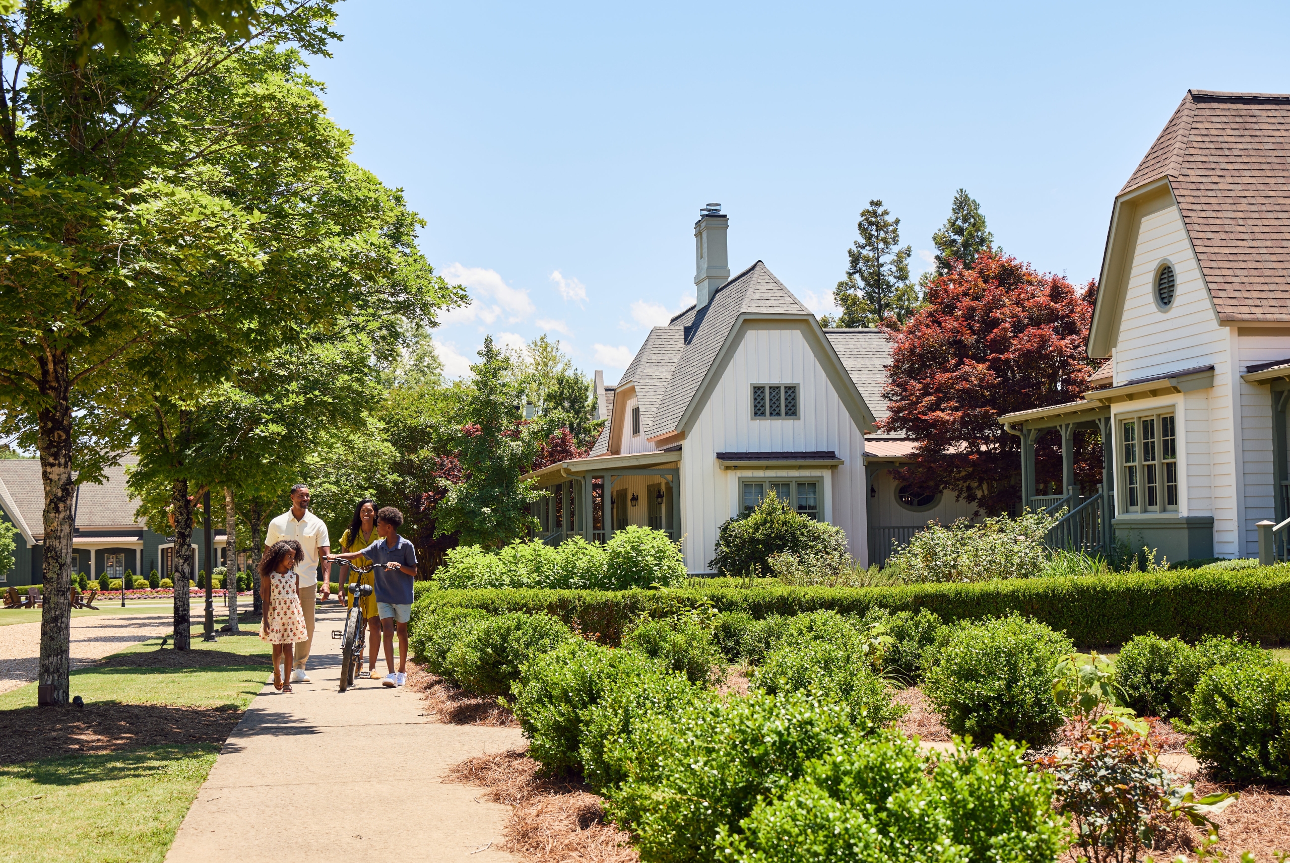 A family walking down a path at a resort