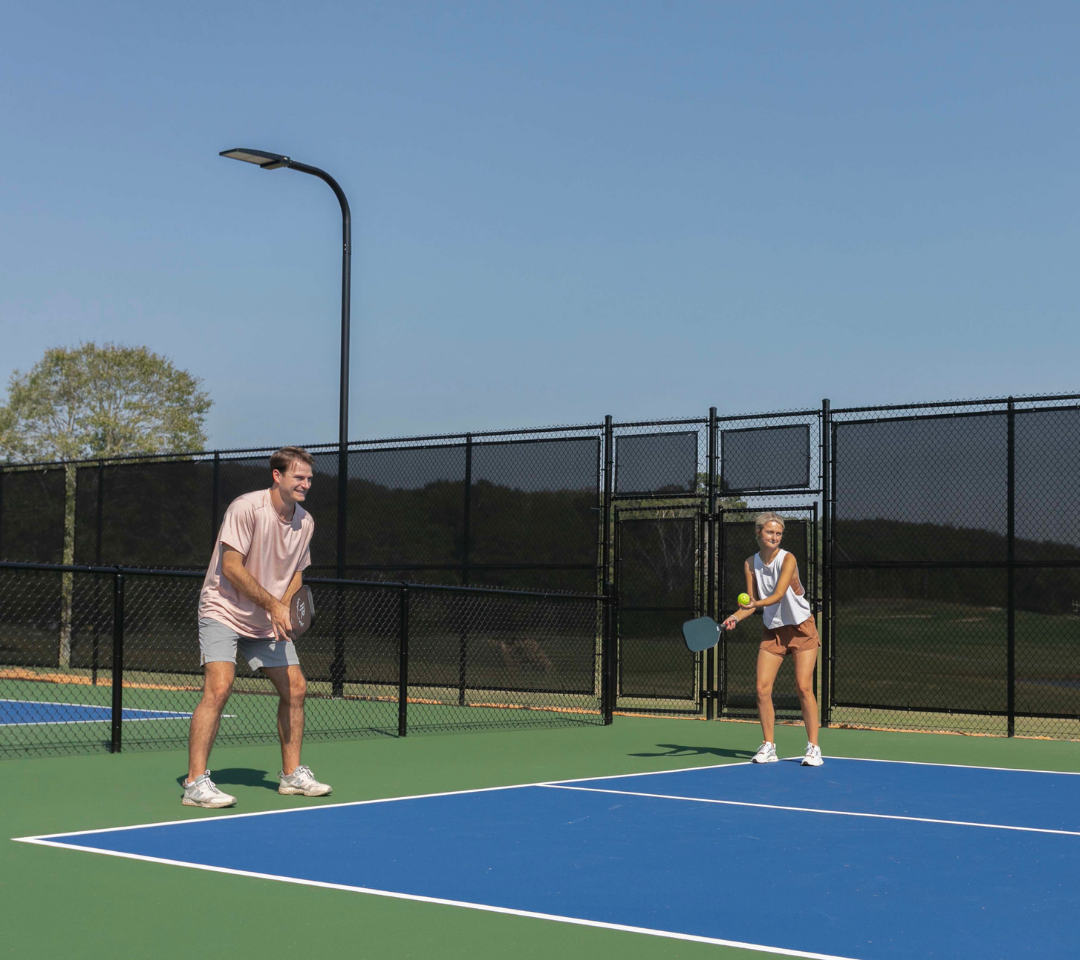 two people playing pickleball