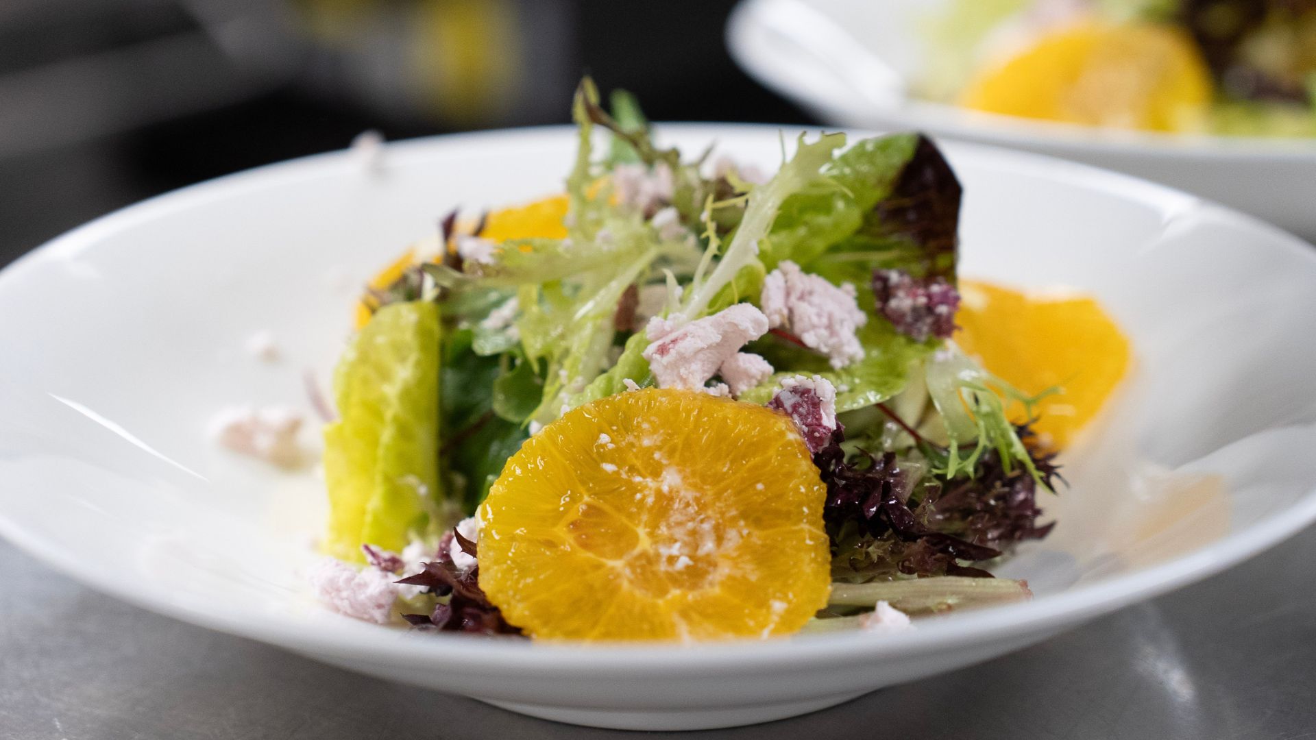 bowl of lettuce and fruits