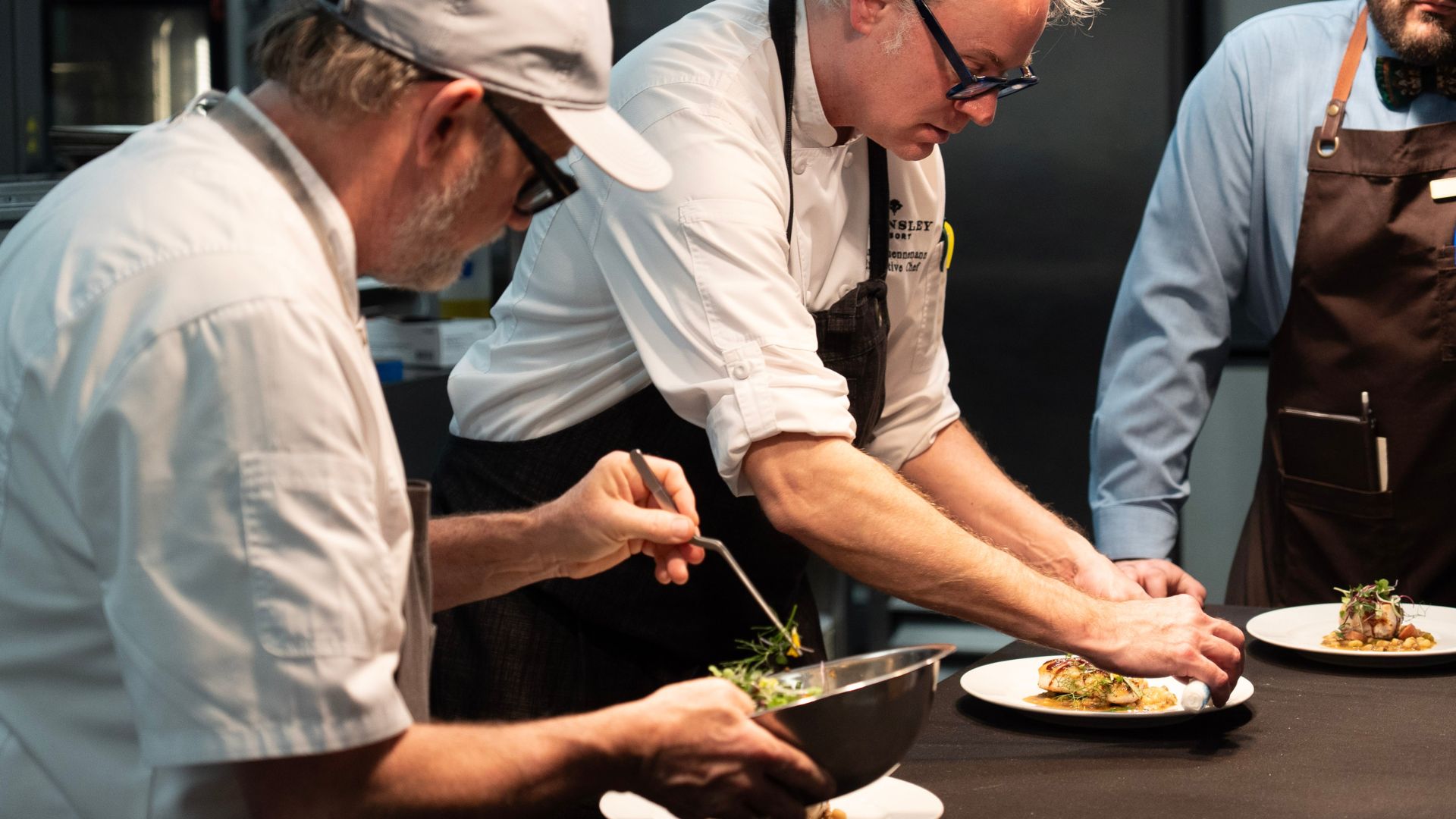 two chefs cooking in kitchen