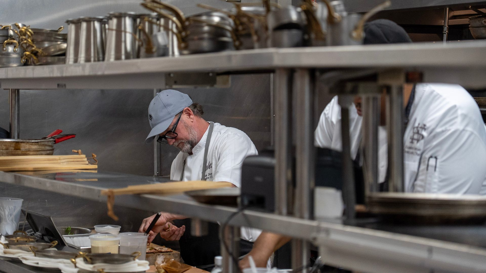 two chefs cooking in kitchen