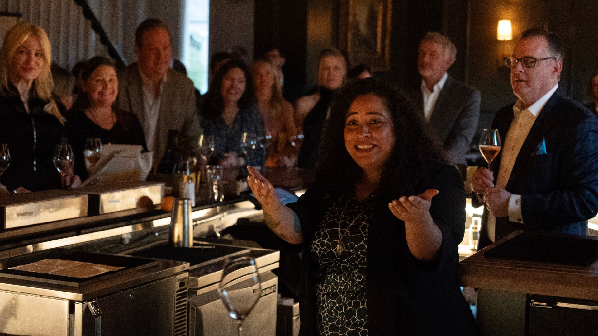 woman talking to group of people