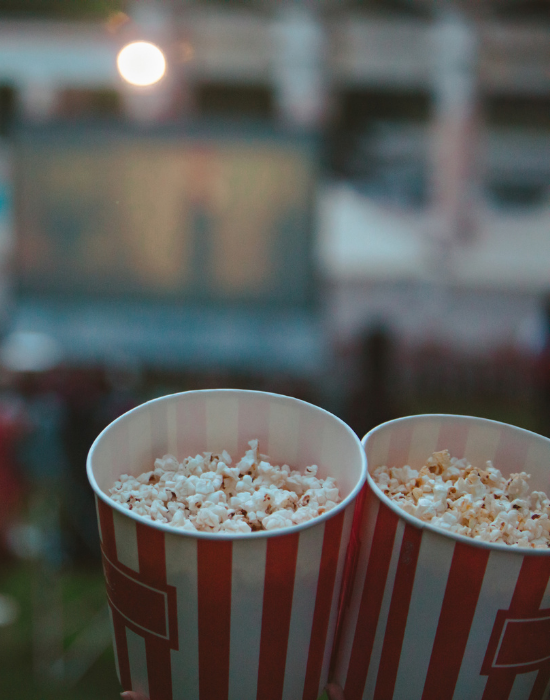 close up of two bags of popcorn outdoors