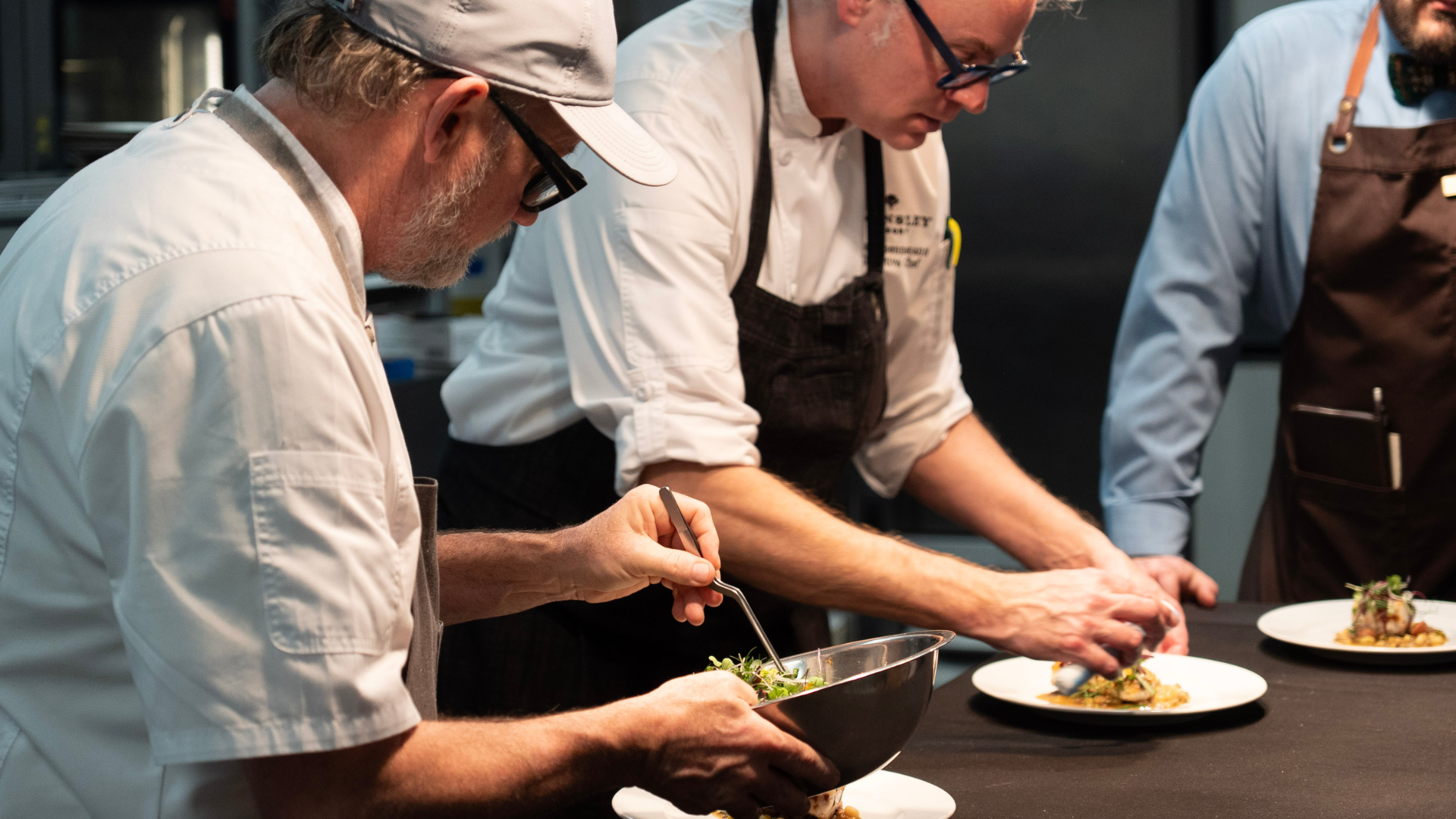 two chefs cooking in kitchen