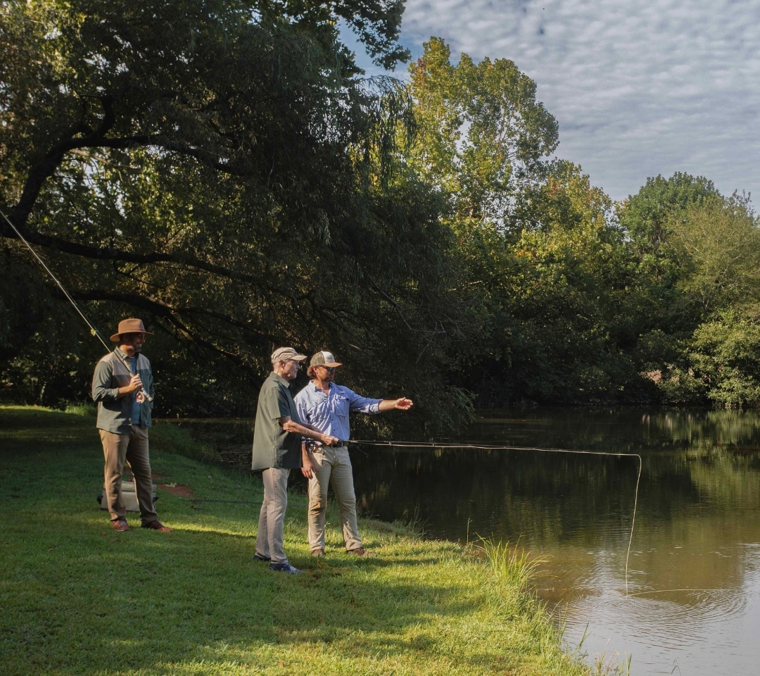 three men fishing