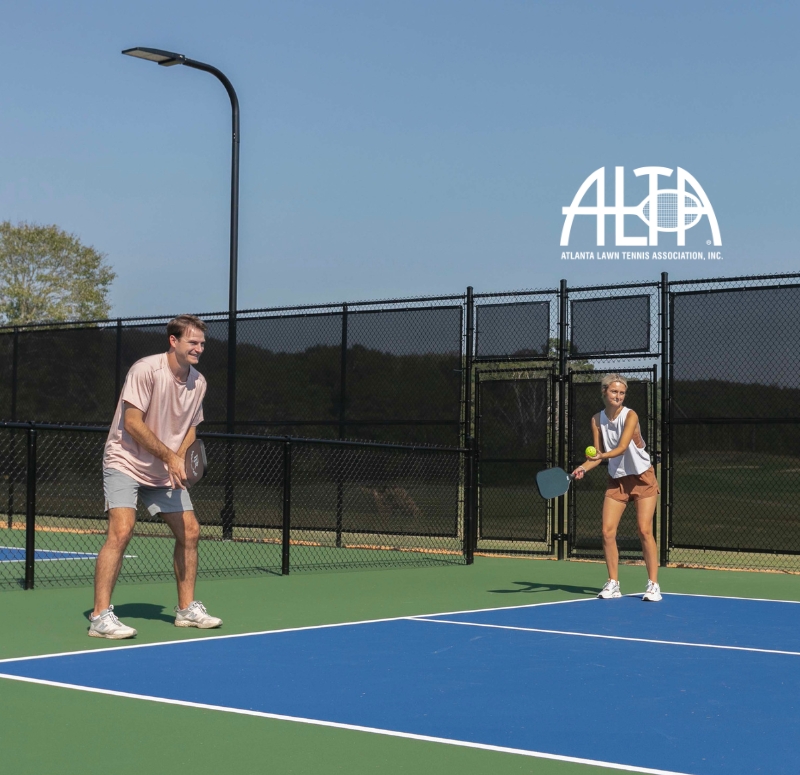 two people playing pickleball