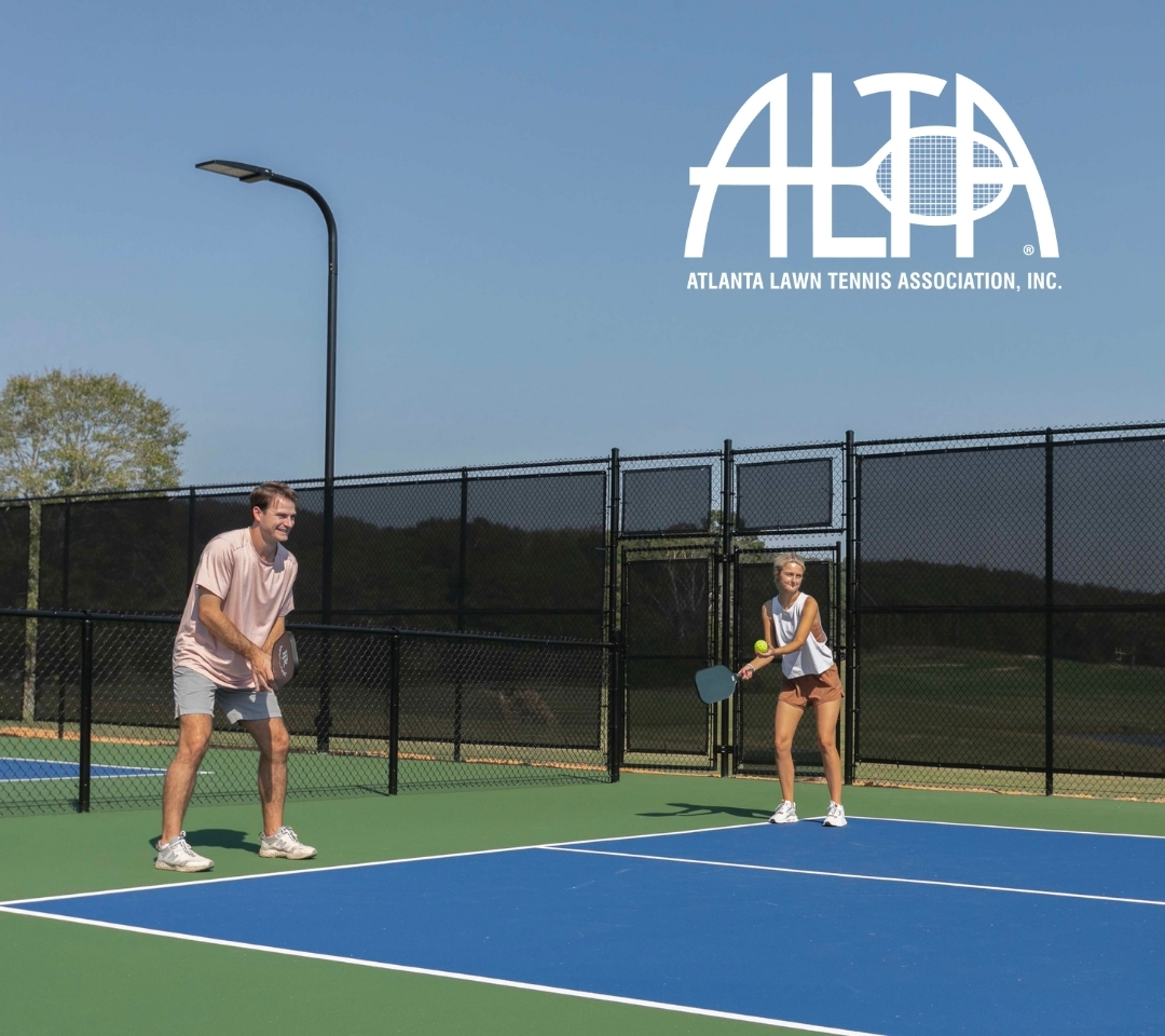 two people playing pickleball