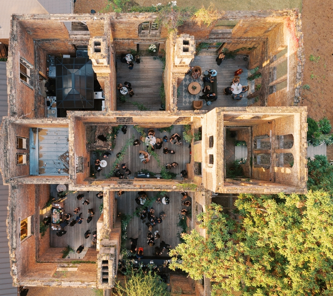 aerial of a open roof brick building