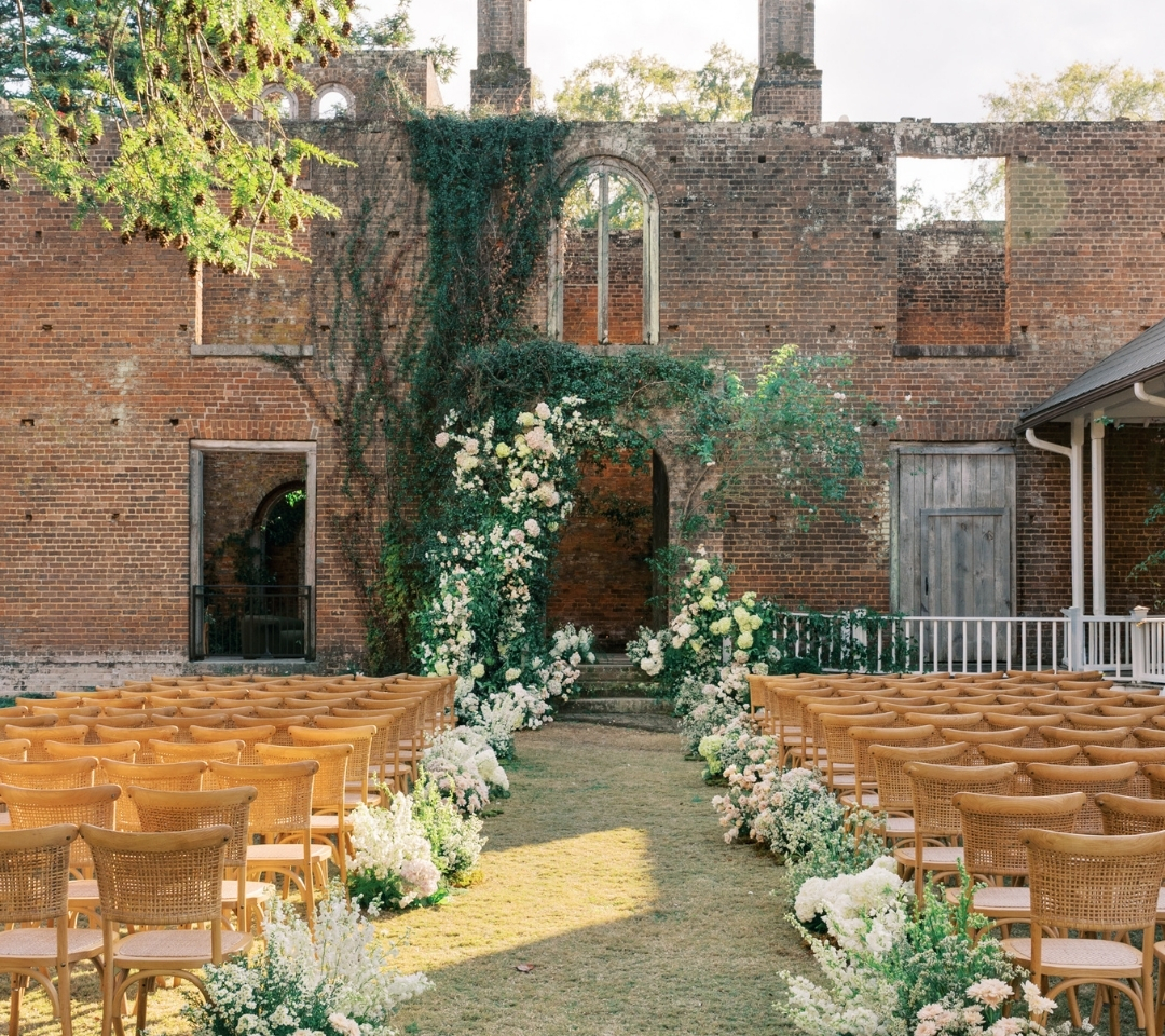 brick building with chairs lined in lawn
