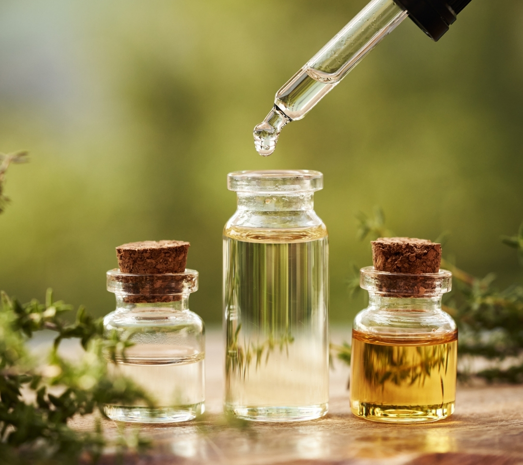 essential oils dripping in bottles