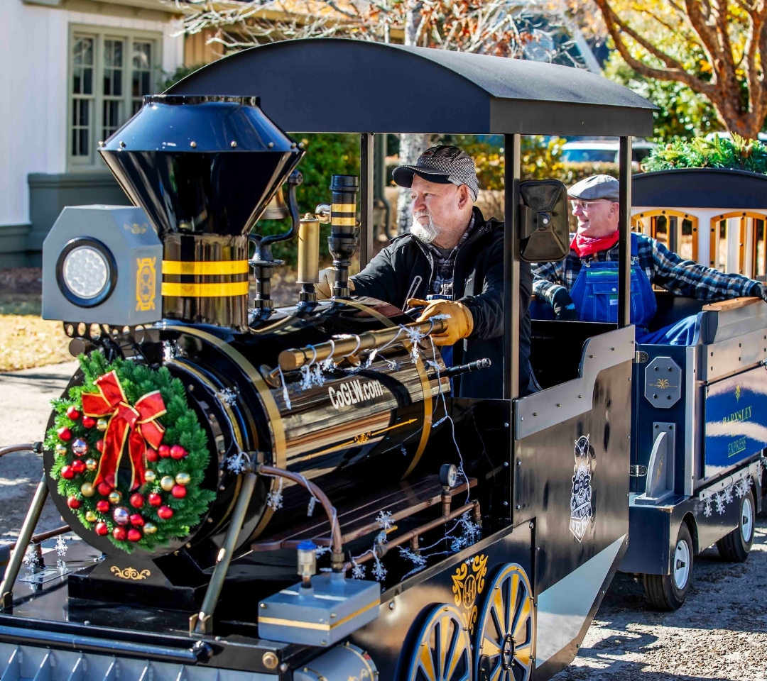 a man in a train with holiday decor