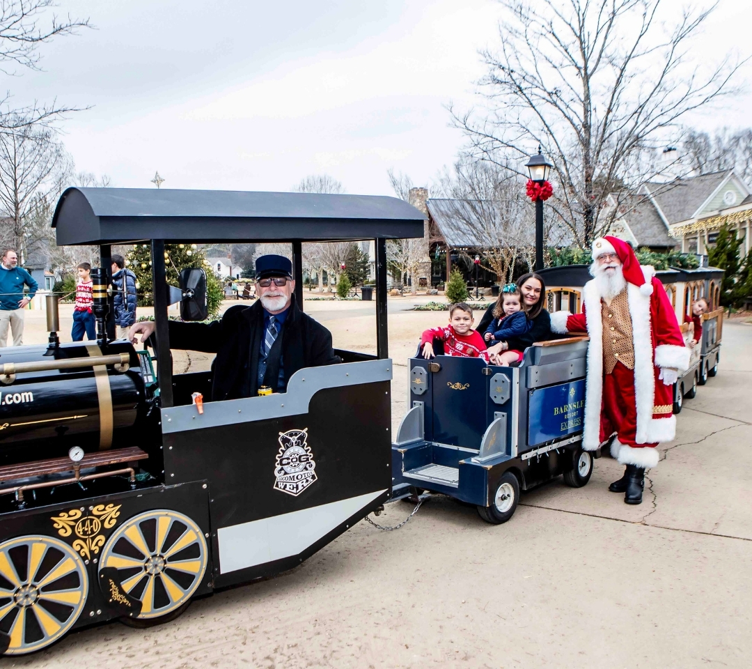 a man in a train with holiday decor