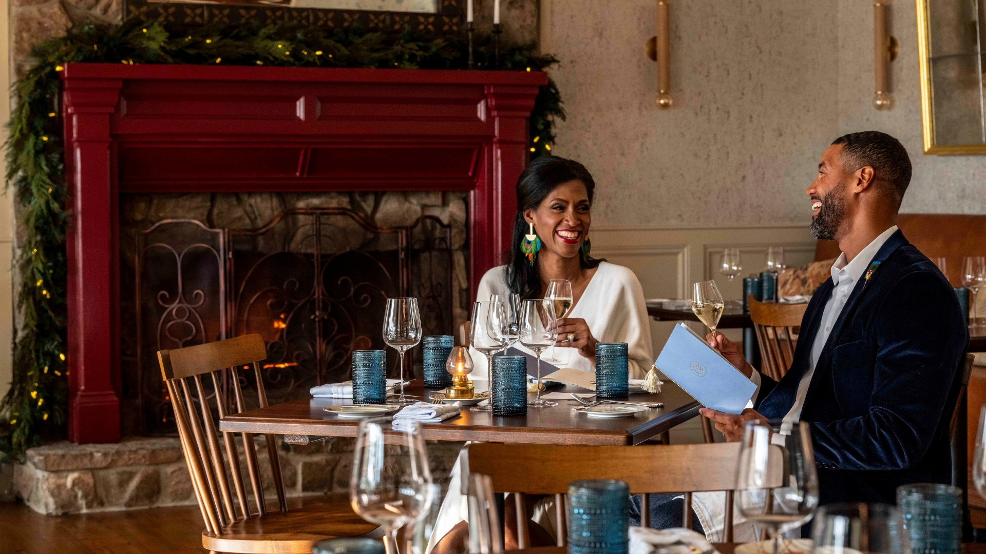 a couple sits at a dining table at a restaurant