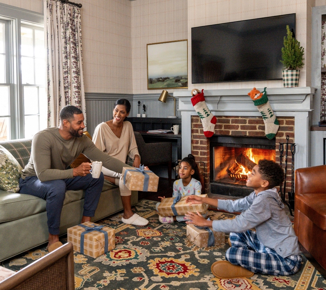 a family passing holiday gifts to each other
