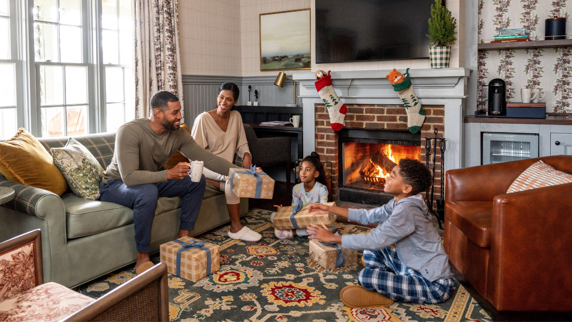 a family passing holiday gifts to each other